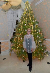 Bonnie next to a Christmas tree
